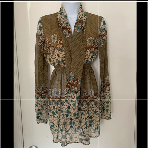 Definitely boho vibes.  Sheer long-sleeved top w/ elastic waist and tie at neck. - Picture 1 of 6